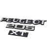 Vue des 3 badges XT posés sur un coffre 205 restauré, adhésif déjà en place.