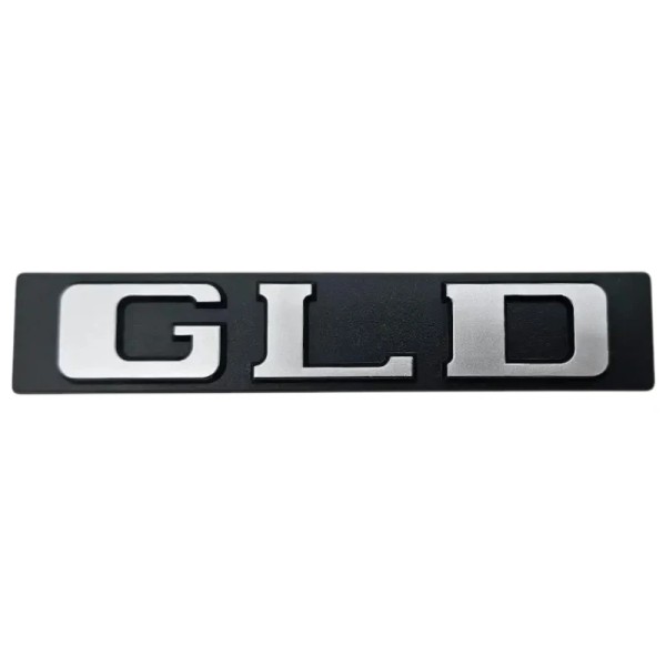 Lot de 3 monogrammes logos de coffre neufs Peugeot 309 GLD, noirs et gris.